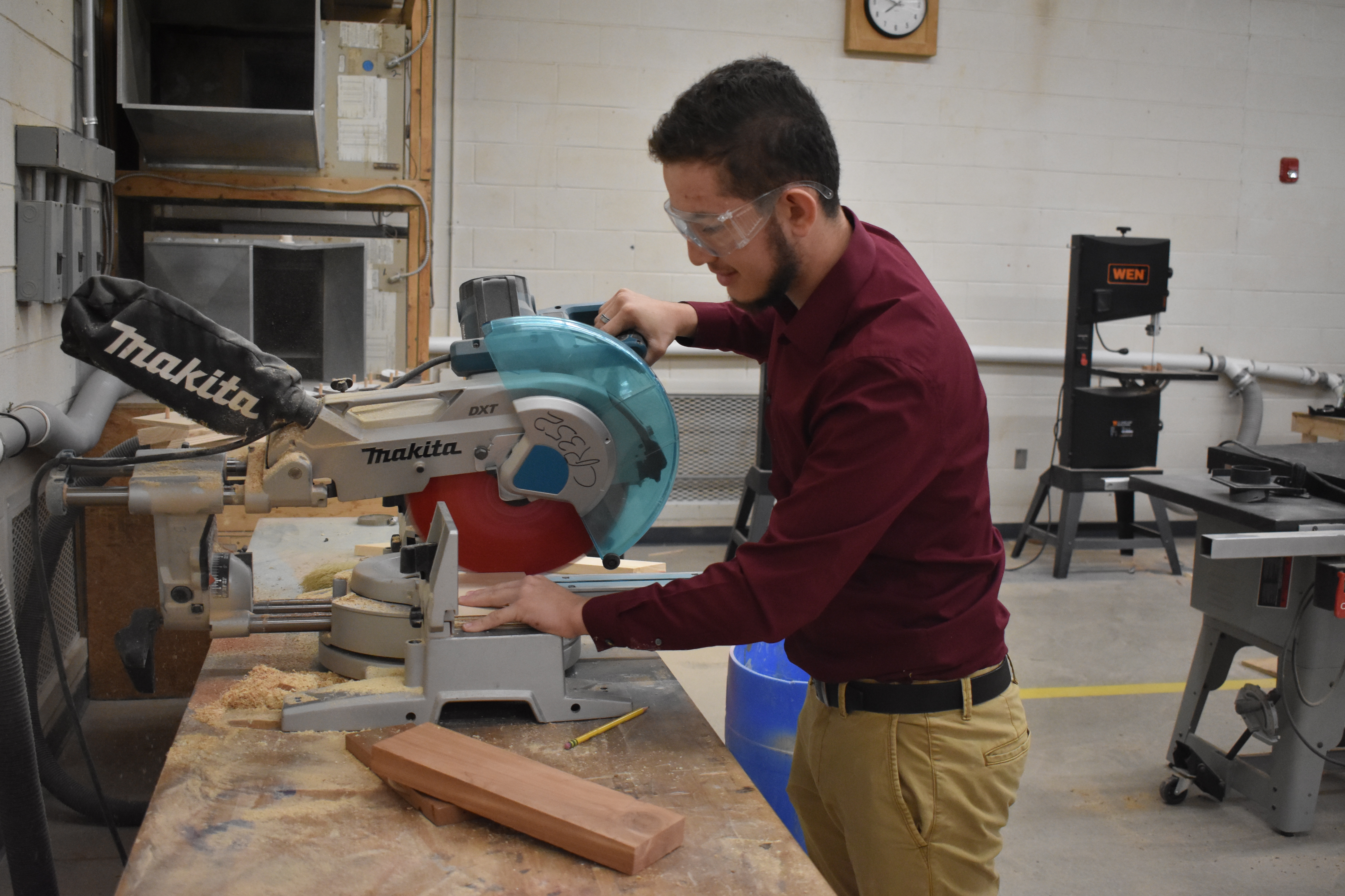  Kevin Favela, a senior at J.Z. George High School, practices for the upcoming SkillsUSA cabinetry competition.