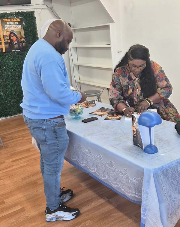 Left: Also pictured: Marcus West, an education colleague, shows his support to Watkins. 