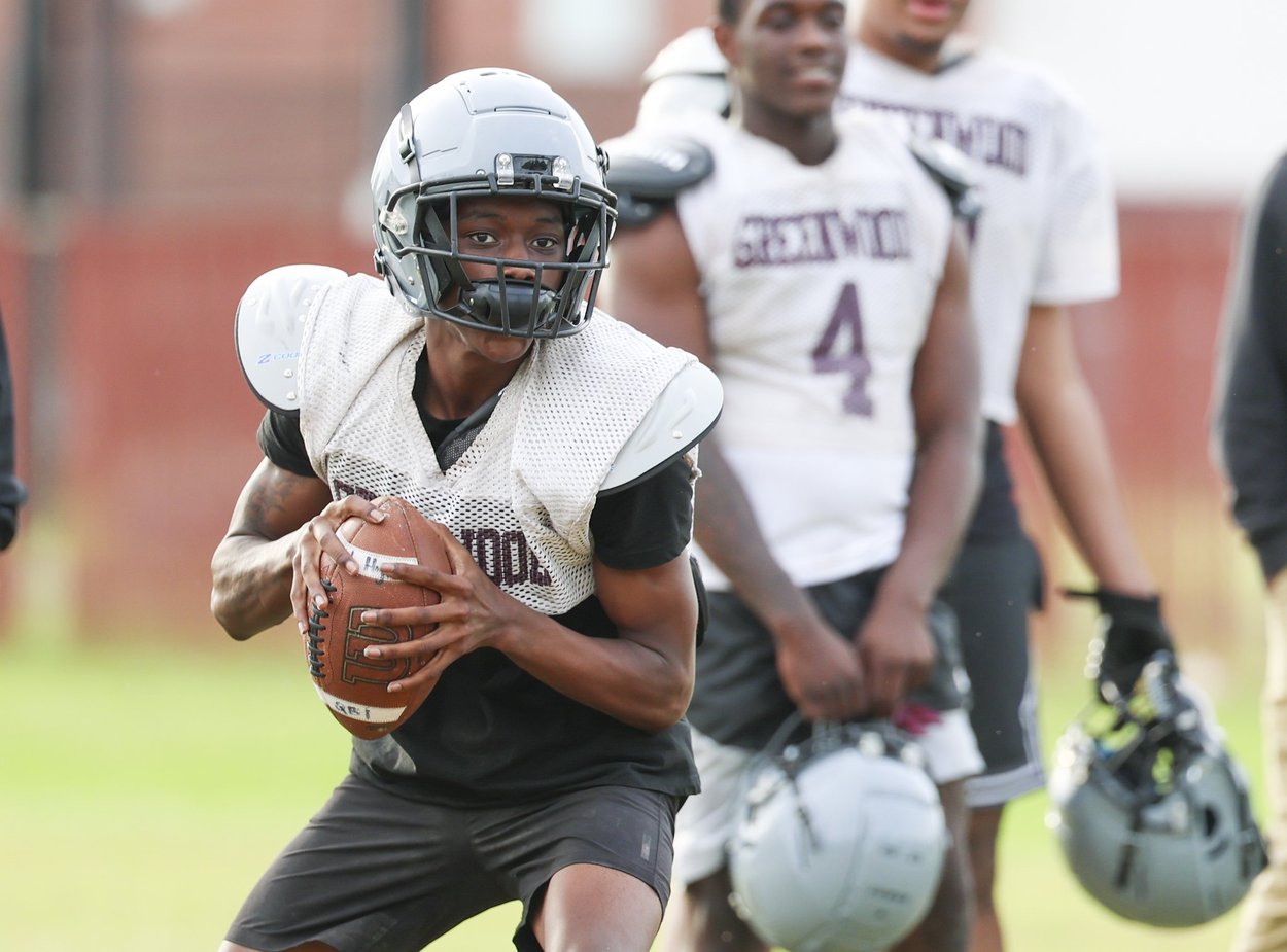 Greenwood High School quarterback Javion Meeks sets to throw a pass during Monday's practice. (Copyright 2025 Emmerich Newspapers, Inc.) 