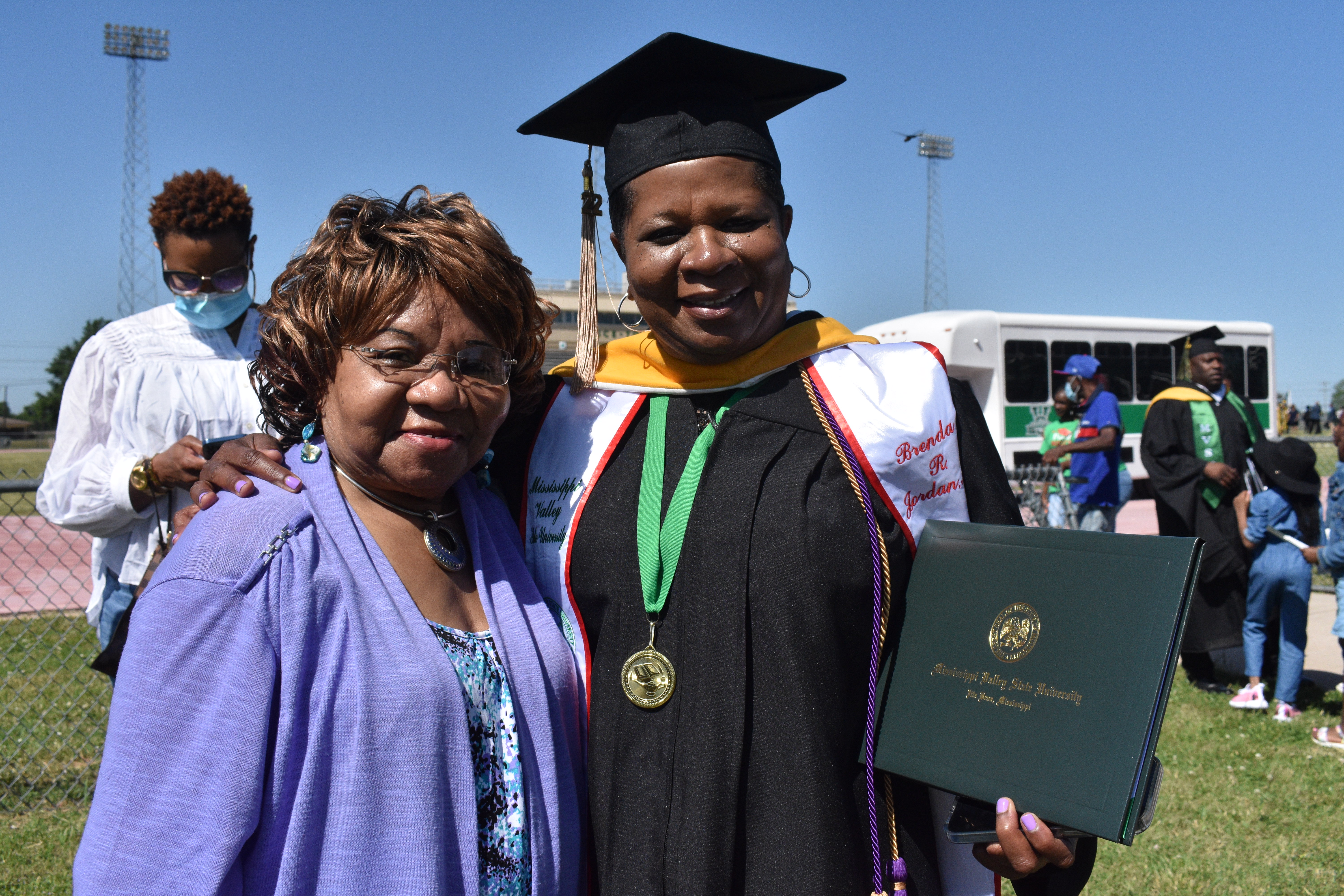 Brenda Jones, right, who received her master’s degree in business administration, celebrates her graduation with her mother, Ruby Mosby.