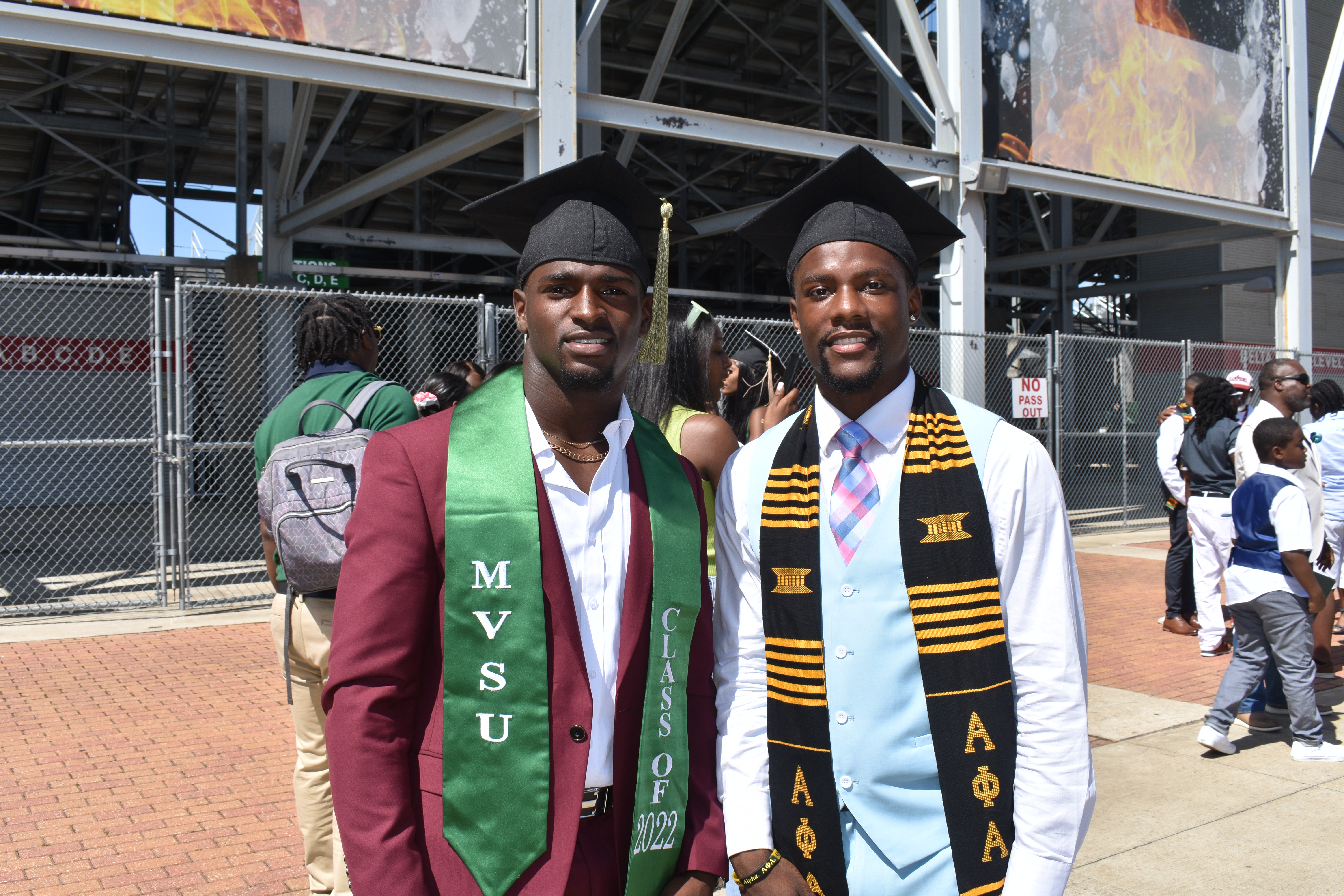Keonte Daniels, left, and Jarius Clayton, celebrate their graduation. Both received a bachelor’s degree in health, physical education and recreation. 