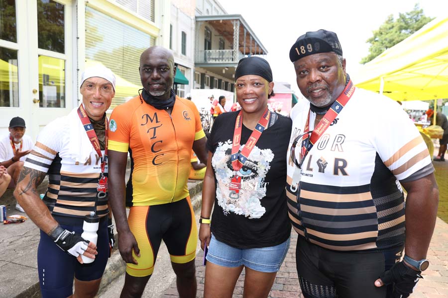 From left, Leo Traverso of Chicago, Arree Williams of Madison, Geneva Carter of San Antonio, Texas and Bill Gaston of Chicago celebrate the end of their rides during Saturday’s Bikes, Blues & Bayous bike ride. The four are a part of their city’s chapter of the Major Taylor Cycling Club, which pays homage to the first Black professional in the sport. 