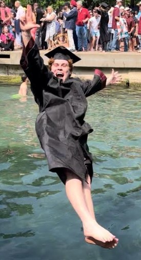Texas State tradition is to jump in the San Marcos River after the graduation ceremon