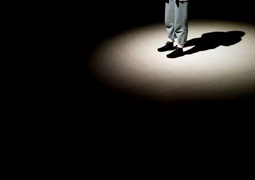 A shadow is cast on the stage of the Trafo House of Contemporary Arts while technicians set up the lighting in Budapest, Hungary, Sept. 19, 2022. Theaters and other cultural institutions in Hungary are reeling from exponentially growing energy prices, and some plan to close for the winter to avoid the skyrocketing bills. The Erkel Theatre in the capital of Budapest will close in November after its utilities went up as much as tenfold, and local governments across the country have ordered theater