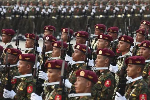 Military officers march during a parade to commemorate Myanmar's 78th Armed Forces Day in Naypyitaw, Myanmar, on March 27, 2023. Myanmar’s military government on Wednesday Feb. 14, 2024 revealed how it will implement its newly activated conscription law, saying it will draft 60,000 young men and women yearly for military service, and that call-ups will begin after the April festival marking the country’s traditional New Year. (AP Photo/Aung Shine Oo, File)