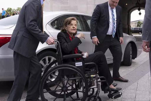 Sen. Dianne Feinstein, D-Calif., is assisted to a wheelchair by staff as she returns to the Senate after a more than two-month absence, at the Capitol in Washington, Wednesday, May 10, 2023. Feinstein's ongoing medical struggles have raised a sensitive political question with no easy answer: Who would California Democratic Gov. Gavin Newsom pick to replace her if the seat became vacant? (AP Photo/J. Scott Applewhite, File)