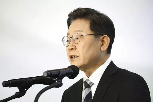Lee Jae-myung, a candidate of the ruling Democratic Party for next March's presidential election, speaks during a New Year press conference at a Kia Motors' plant in Gyeonggi-do, South Korea Tuesday, Jan. 4, 2022.  (Chung Sung-Jun/Pool Photo via AP)