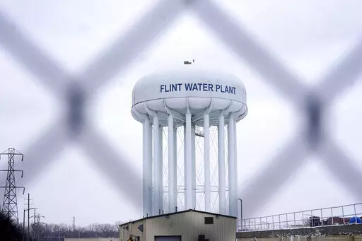The Flint water plant tower is seen on Jan. 6, 2022, in Flint, Mich. A judge declared a mistrial Thursday, Aug. 11, after jurors said they couldn't reach a verdict in a dispute over whether two engineering firms should bear some responsibility for Flint's lead-contaminated water. Four families accused Veolia North America and Lockwood, Andrews & Newman, known as LAN, of not doing enough to get Flint to treat the highly corrosive water or to urge a return to a regional water supplier. (AP Photo/C