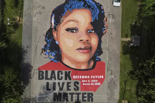 A ground mural depicting a portrait of Breonna Taylor is seen at Chambers Park in Annapolis, Md., July 6, 2020. The U.S. Justice Department has found Louisville police have engaged in a pattern of violating constitutional rights following an investigation prompted by the fatal police shooting of Taylor. The announcement was made Wednesday, March 8, 2023, by Attorney Merrick Garland. (AP Photo/Julio Cortez, File)