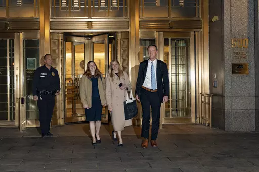 Graham Chase Robinson, center, and her attorneys Alexandra Hardin, center left, and Brent Hannafan, right, depart a federal courthouse in New York on Thursday, Nov. 9, 2023. (AP Photo/Peter K. Afriyie)