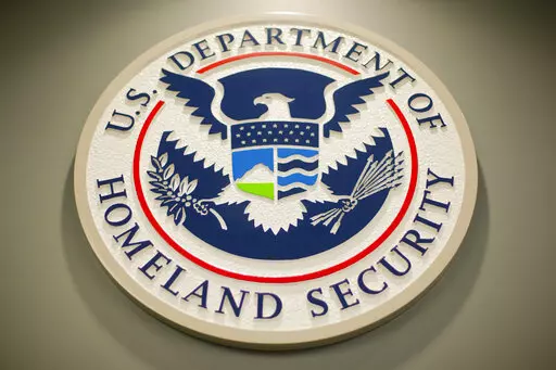 Homeland Security logo is seen during a joint news conference in Washington, Feb. 25, 2015. Nina Jankowicz, the former head of a widely criticized disinformation board, faced a torrent of sexist profanities on social media and menacing emails filled with rape or death threats. And she is not alone as women around the globe who have risen to powerful government positions have faced an overwhelming crush of online harassment, stalking and abuse. (AP Photo/Pablo Martinez Monsivais, File)