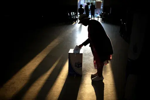 A woman casts her ballot at a polling station, during general elections in Eshowe, South Africa, on May 29, 2024. (AP Photo/Emilio Morenatti, File)