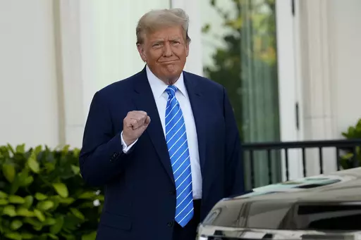 Former President Donald Trump pumps his fist as he arrives for a GOP fundraiser, Saturday, April 6, 2024, in Palm Beach, Fla. (AP Photo/Lynne Sladky)
