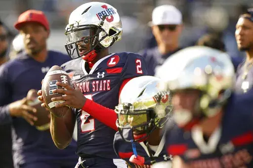 Jackson State quarterback Shedeur Sanders (2) drops back to pass during warmups prior to the first half of the Southwestern Athletic Conference championship NCAA college football game against Southern University, Saturday, Dec. 3, 2022, in Jackson, Miss. (AP Photo/Rogelio V. Solis)
