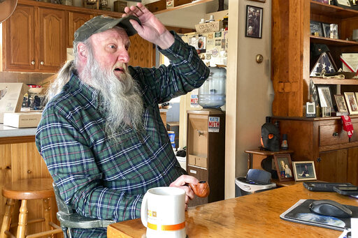 Ray Kemble talks about his water issues in his home in Dimock, Pa., Feb. 14, 2022. Kemble recently met with officials in the Pennsylvania attorney general's office regarding the criminal case against a gas driller charged with polluting Dimock's groundwater with methane. Faulty gas wells drilled by Cabot Oil & Gas were blamed for leaking methane into the groundwater in Dimock, in one of the best-known pollution cases ever to emerge from the U.S. drilling and fracking boom. (AP Photo/Mike Rubinka