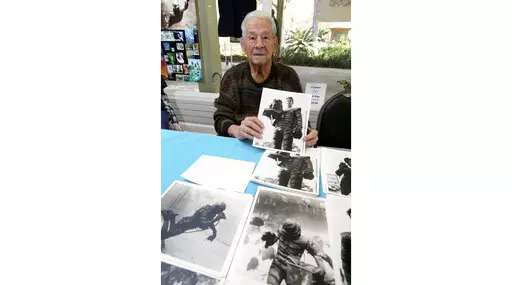 Ricou Browning, who played the creature in "Creature from the Black Lagoon," poses for photos for people during Florida SpringsFest at Silver Springs State Park in Silver Springs, Fla., Sunday, March 4, 2018. Browning, best known for playing the Gill Man in the 1954 monster movie “Creature from the Black Lagoon,” has died. His family told news outlets Browning died Feb. 27, 2023, at his home in Southwest Ranches, Fla. He was 93. (Bruce Ackerman/Ocala Star-Banner via AP)