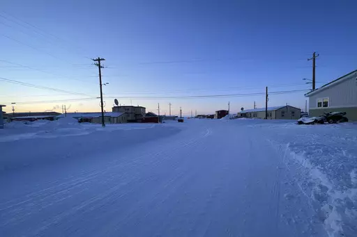 The sun sets in the northwest Alaska village of Point Hope, on the Chukchi Sea on Feb. 21, 2024. A fatal shooting at a home in a remote Inupiat whaling village on Alaska's northwest coast on Sunday, Feb. 25, 2024, shook the small community in Point Hope. (Ka'ainoa Ravey via AP)