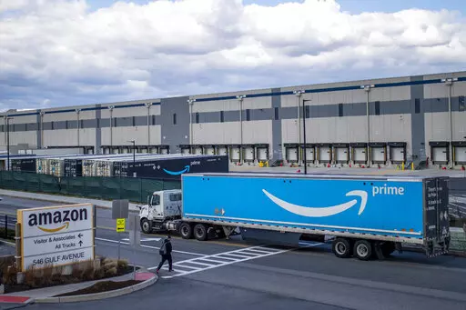 A truck arrives at the Amazon warehouse facility on the Staten Island borough of New York, April 1, 2022. Amazon is barring off-duty warehouse workers from the company’s facilities, a move organizers say can hamper union drives. (AP Photo/Eduardo Munoz Alvarez, File)