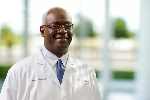 This undated photo provided by the Saint Francis Health System shows Dr. Preston Phillips. Dr. Preston Phillips and Dr. Stephanie Husen, along with  a receptionist and a former soldier accompanying his wife during a checkup were killed in a mass shooting inside a Tulsa medical building, authorities said Thursday, June 2, 2022 .(Saint Francis Health System via AP)