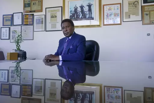 Attorney John Burris poses for photos at his office in Oakland, Calif., Tuesday, Aug. 16, 2022. For nearly 50 years, Burris has poked holes into narratives that did not add up, namely those of law enforcement accused of using excessive force. (AP Photo/Jeff Chiu)