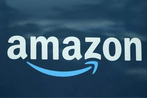 An Amazon logo appears on a delivery van, Oct. 1, 2020, in Boston. Amazon plans to eliminate 9,000 more jobs in the next few weeks, the company's CEO Andy Jassy said in a memo to staff on Monday, March 20, 2023. The job cuts would mark the second largest round of layoffs in the company's history, adding to the 18,000 employees the company said it would lay off in January. (AP Photo/Steven Senne, File)