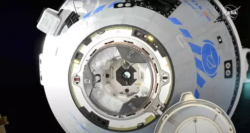 This image from NASA TV shows the Boeing Starliner preparing to dock at the International Space Station, Friday, May 20, 2022. Boeing's astronaut capsule has arrived at the International Space Station in a critical repeat test flight. Only a test dummy was aboard the capsule for Friday's docking, a huge achievement for Boeing after years of false starts. (NASA via AP)