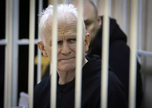 FILE Ales Bialiatski, the head of Belarusian Vyasna rights group, sits in a defendants' cage during a court session in Minsk, Belarus, on Thursday Jan. 5, 2023. For nearly three years, a harsh crackdown on dissent in Belarus by its authoritarian leader Alexander Lukashenko has filled the country’s penal colonies with thousands of political prisoners, with new arrests reported daily. At the same time, a government campaign has gotten rid of many independent lawyers, making it difficult for the 