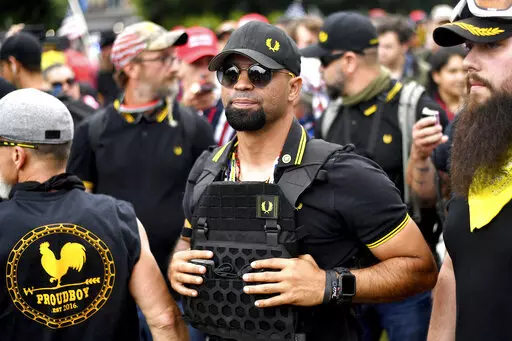 Proud Boys chairman Enrique Tarrio attends a rally in Portland, Ore., Aug. 17, 2019. Jury selection for the seditious conspiracy trial of former Proud Boys leader Enrique Tarrio and four lieutenants will resume in early January after a holiday break. The judge presiding over the case against the far-right extremist group members questioned prospective jurors for a fifth day on Friday, Dec. 23, 2022. (AP Photo/Noah Berger, File)