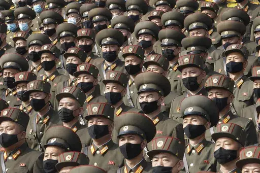 Soldiers wearing face masks to help curb the spread of the coronavirus rally to welcome the 8th Congress of the Workers' Party of Korea at Kim Il Sung Square in Pyongyang, North Korea, on Oct. 12, 2020. (AP Photo/Jon Chol Jin, File)