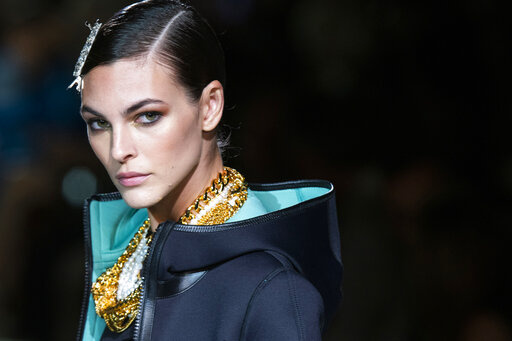 A model walks the runway at the Tom Ford spring/summer 2022 fashion show at Lincoln Center during New York Fashion Week on Sunday, Sept. 12, 2021. (AP Photo/Eduardo Munoz Alvarez)