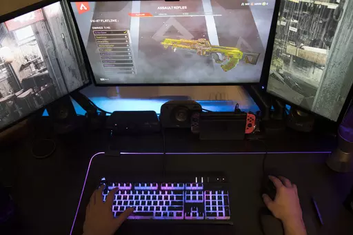A gamer plays Electronic Arts' "Apex Legends" in Jersey City, N.J., on March 6, 2019. The enthusiasm military personnel have for gaming, and the risk that carries is in the spotlight after Jack Teixeira, a 21-year-old Massachusetts Air National Guardsman, was charged with illegally taking and posting highly classified material on Discord, a social media platform that started as a hangout for gamers. Online gaming forums have long been a particular worry of the military because of their lure for 