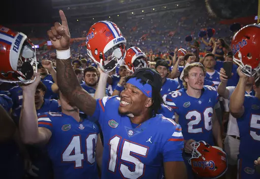 Florida quarterback Anthony Richardson (15) celebrates with teammates after an NCAA college football game against South Carolina on Saturday, Nov. 12, 2022, in Gainesville, Fla. Bryce Young, C.J. Stroud, Anthony Richardson and Will Levis are projected to go anywhere from the top 5 to top 15 picks in this draft. (AP Photo/Matt Stamey, FIle)