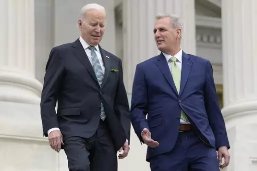President Joe Biden talks with House Speaker Kevin McCarthy of Calif., as they walk down the House steps as they leave after attending an annual St. Patrick's Day luncheon gathering at the Capitol in Washington, March 17, 2023. The Tuesday, May 9, White House sitdown between the president and congressional leaders will be the first substantive talks between Biden and McCarthy in months, and comes weeks after House Republicans voted on a bill that would raise the debt limit but impose significant