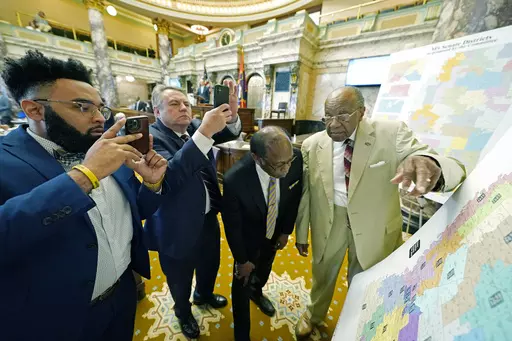 Mississippi state Sens. Rod Hickman, D-Macon, left; Michael McLendon, R-Hernando, second from left; Albert Butler, D-Port Gibson; and David Jordan, D-Greenwood, review an alternate Senate redistricting map during debate on the floor of the Senate at the state Capitol in Jackson, Miss., March 29, 2022. Three federal judges started hearing arguments on Monday, Feb. 26, 2024, in a lawsuit that challenges the racial composition of some Mississippi House and Senate districts. (AP Photo/Rogelio V. Sol