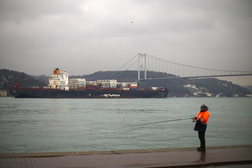 Cargo ship Oakland crosses the Bosphorus strait towards the Marmara sea after departing from Russia's Novorossiysk port, in Istanbul, Tuesday, March 1, 2022. Turkey, which is trying to balance its support for Ukraine with its fragile economic ties to Russia, said Monday it is implementing an international convention that allows the country to shut down the straits at the entrance of the Black Sea to warships, to avoid an escalation of the conflict. (AP Photo/Francisco Seco, File)