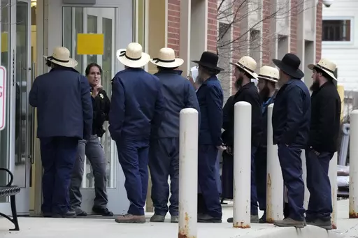 A group of Amish gather outside the Crawford County Judicial Center in Meadville, Pa., following a preliminary hearing, March 15, 2024, for Shawn C. Cranston, 52, of Corry, Pa., who is accused of killing Rebekah Byler and her unborn child inside the Byler home near Spartansburg, Pa., on Feb. 26. Six guns, a variety of ammunition and a pair of sneakers that may match tread marks left at the murder scene were seized during searches of the home and vehicle of a man accused of killing the pregnant A