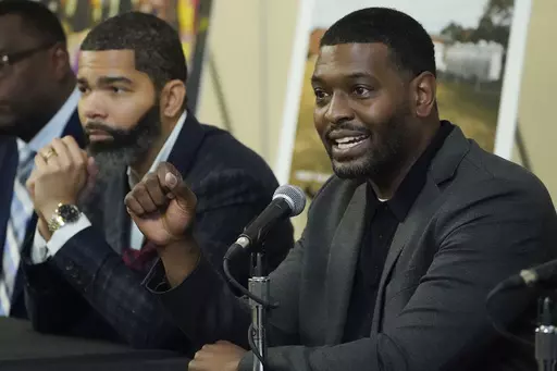 EPA Administrator Michael S. Regan, right, addresses a roundtable of Jackson-area businesspeople, community leaders, residents and educators, as Jackson Mayor Chokwe Antar Lumumba, left, listens, Nov. 15, 2022, at Jackson State University, in Jackson, Miss. The EPA said Monday, May 6, 2024, that it found “insufficient evidence” that racial discrimination shaped decisions made by two Mississippi agencies about water system funding for the majority-Black city of Jackson. (AP Photo/Rogelio V. S