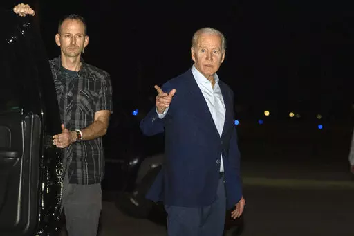 President Joe Biden arrives at Henry E. Rohlsen Airport, in St. Croix, U.S. Virgin Islands, late Tuesday, Dec. 27, 2022. Biden on Thursday signed a $1.7 trillion spending bill that will keep the federal government operating through the end of the federal budget year in September 2023, and provide tens of billions of dollars in new aid to Ukraine for its fight against the Russian military. (AP Photo/Manuel Balce Ceneta, File)