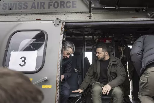 Switzerland's Foreign Minister Federal Councillor Ignazio Cassis, left, and Ukrainian President Volodymyr Zelenskyy sit in a helicopter of the Swiss Air Force after Zelenskyy's arrival at Zurich's Kloten airport, Switzerland, Monday, Jan. 15, 2024. Zelenskyy is in Switzerland to attend the World Economic Forum in Davos starting Tuesday. (Alessandro della Valle/Keystone via AP)