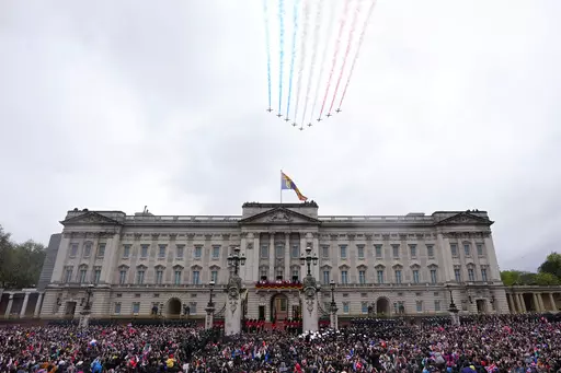 Britain's King Charles III and Queen Camilla on the balcony of Buckingham Palace watch the Royal Air Force Red Arrows fly over after their coronation ceremony, in London, on May 6, 2023. A change in monarchs, double-digit inflation and ongoing costs of renovating Buckingham Palace contributed to a 5% increase in publicly-funded spending by Britain's royals, royal accounts published Thursday, June 29, 2023 showed. (AP Photo/Petr David Josek, File)