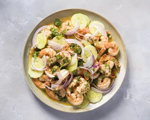 This image released by Milk Street shows a recipe for drunken shrimp with tequila (Camarones Borrachos). (Milk Street via AP)