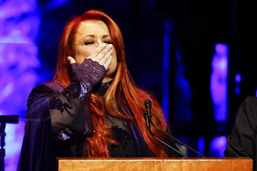 Wynonna Judd blows a kiss to attendees during the Medallion Ceremony at the Country Music Hall Of Fame Sunday, May 1, 2022, in Nashville, Tenn. (Photo by Wade Payne/Invision/AP)