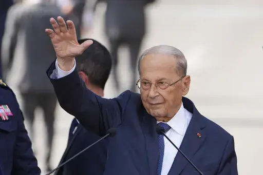 Lebanese President Michel Aoun waves for his supporters during a speech to his supporters gathered outside the presidential palace in Baabda, east of Beirut, Lebanon, Oct. 30, 2022. Lebanon has been without a president for over a month, and its legislators since late September have been unable to vote for a new president. President Aoun completed his six-year term on Oct. 30. Lebanon’s deeply-divided parliament has met nine times to elect a successor and failed every time, worsening political 