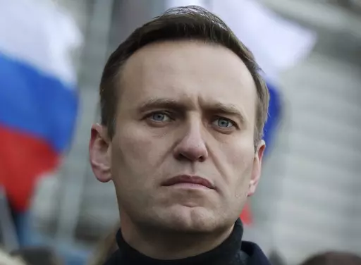 Russian opposition activist Alexei Navalny takes part in a march in memory of opposition leader Boris Nemtsov in Moscow, Russia on Feb. 29, 2020. Associates of imprisoned Russian opposition leader Alexei Navalny say he has been located at a prison colony above the Arctic Circle nearly three weeks after contact with him was lost. Navalny, the most prominent foe of Russian President Vladimir Putin, is serving a 19-year sentence on charges of extremism. (AP Photo/Pavel Golovkin, File)