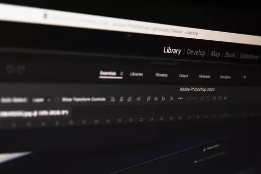 Adobe Photoshop, Lightroom and Bridge program windows are seen on a computer screen, Tuesday, March 12, 2024, in New York. In a world where the spread of technology makes photo manipulation easy, a photo can sometimes raise as many questions as it was meant to answer. That was seen in recent days when controversy swirled around an image of Kate, Princess of Wales, and her three children. (AP Photo/Sydney Schaefer)