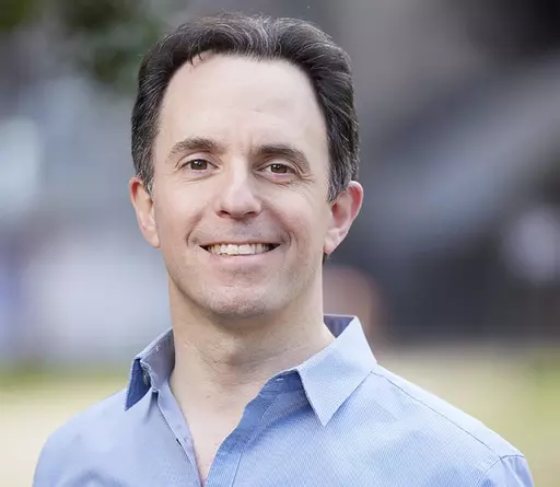 In this undated photo provided by Rebecca Hale, Marc Tyler Nobleman poses for a portrait. The author's clash with a Georgia school district over a mention of someone's homosexuality in a presentation highlights the reach of conservatives' push for what what they call parents' rights. Nobleman at first complied with a request not to mention that the son of Batman's co-creator was gay but then rebelled. He and LGBTQ+ advocates say the Forsyth County district in suburban Atlanta was wrong. The dist