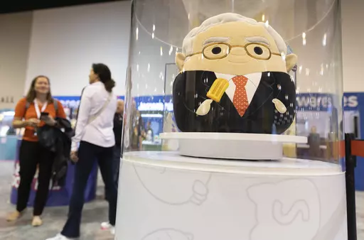 The Squishmallows booth sells toys modeled after Warren Buffett, pictured, and Charlie Munger in the exhibit hall for the Berkshire Hathaway annual meeting, Saturday, May 6, 2023, in Omaha, Neb. In a lawsuit filed Monday, Feb. 12, 2024, Kelly Toys and parent company Jazwares accused Build-A-Bear's new “Skoosherz” line of copying Squishmallows' look and feel. Skoosherz toys have the “same distinctive trade dress” of Squishmallows, the complaint said — pointing to shape, face style, colo