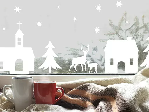 This image provided by Tempaper shows stick on festive decoration on a window. Tempaper's Christmas Village peel-and-stick decals can be put on a wall or window; great if you've got hardly anywhere to decorate for the holidays. This charming Festival of Lights decal from Tempaper can be placed anywhere; it peels right off when the season is over. (Tempaper via AP)