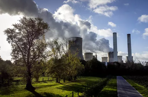 Steam rises from the coal-fired power plant Niederaussem, Germany, on Nov. 2, 2022. The cause of global warming is showing no signs of slowing as heat-trapping carbon dioxide in Earth’s atmosphere increased to record highs in its annual Spring peak, jumping at one of the fastest rates on record, officials announced Monday, June 5, 2023. (AP Photo/Michael Probst, File)