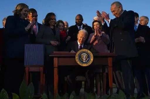 President Joe Biden signs the "Infrastructure Investment and Jobs Act" during an event on the South Lawn of the White House, Nov. 15, 2021, in Washington. Biden will deliver his State of the Union address to a joint session of Congress on Tuesday, March 1, 2022. (AP Photo/Evan Vucci, File)